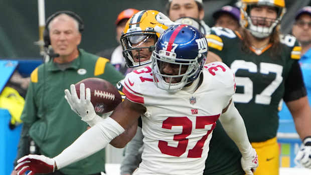 Oct 9, 2022; London, United Kingdom; New York Giants cornerback Fabian Moreau (37) defends against Green Bay Packers wide receiver Allen Lazard (13) in the second half during an NFL International Series game at Tottenham Hotspur Stadium.